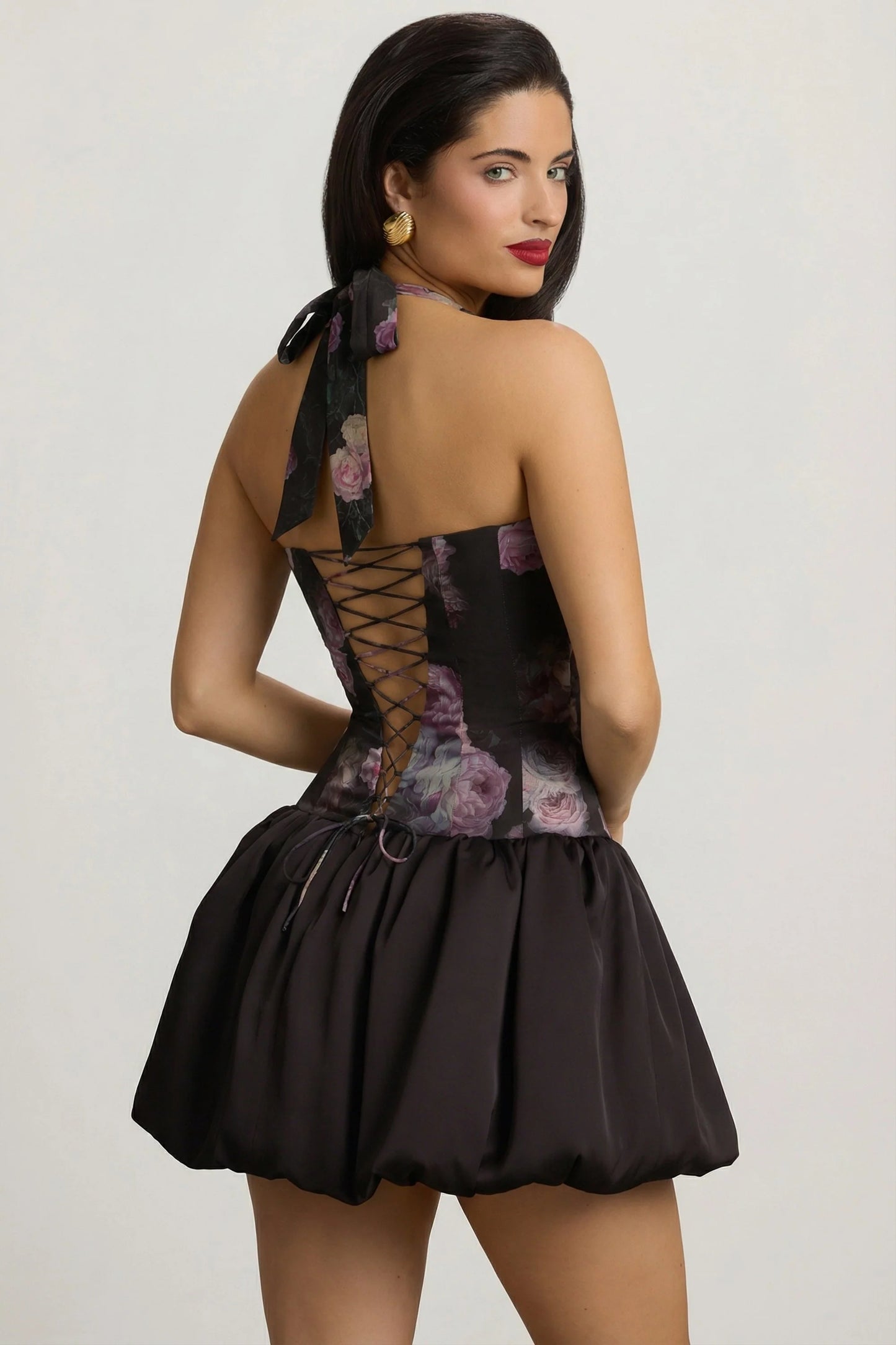 Halterneck Lace-Up Bubble Hem Mini Dress in Black Floral Print