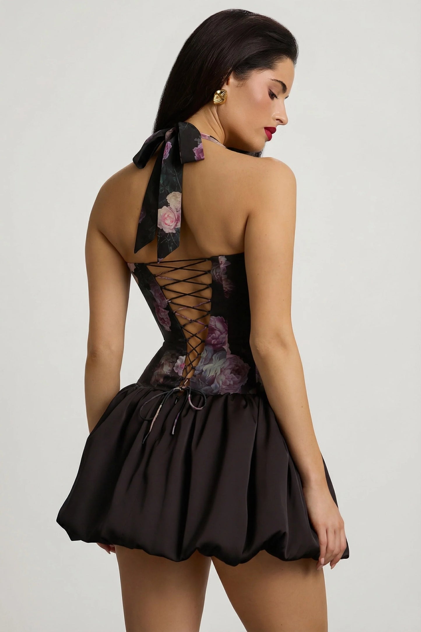 Halterneck Lace-Up Bubble Hem Mini Dress in Black Floral Print