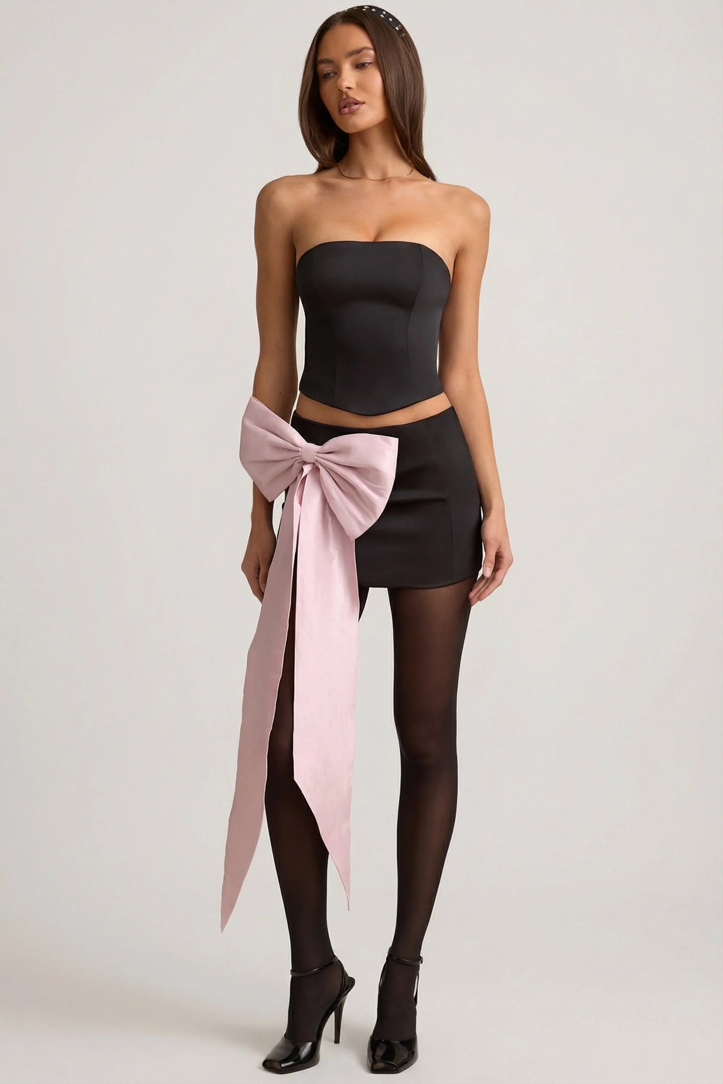 Satin Bow-Detail Low-Rise Mini Skirt in Black